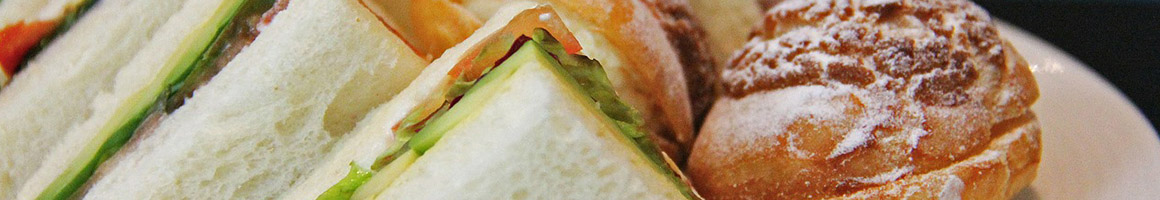 Eating Barbeque Deli Sandwich at Nena's Delights Deli restaurant in Stockton, CA.